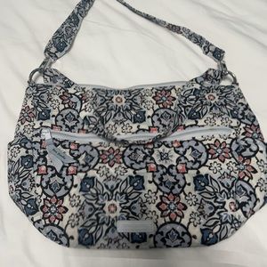 Vera Bradley handbag with adjustable and detachable crossbody strap.